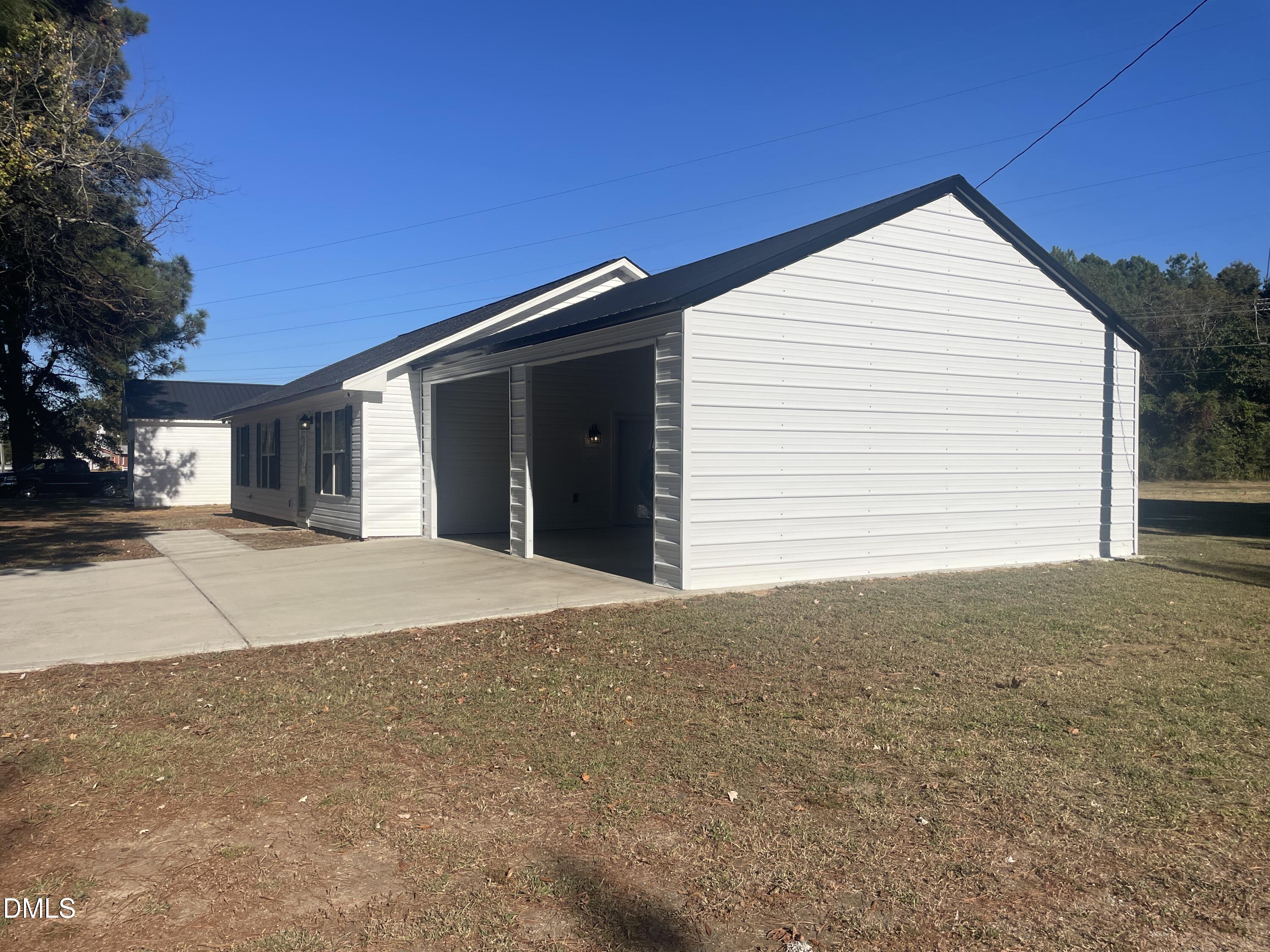 144 Red Hill Church Road Dunn, NC 28334 - Photo 34 of 44 a view of garage and yard
