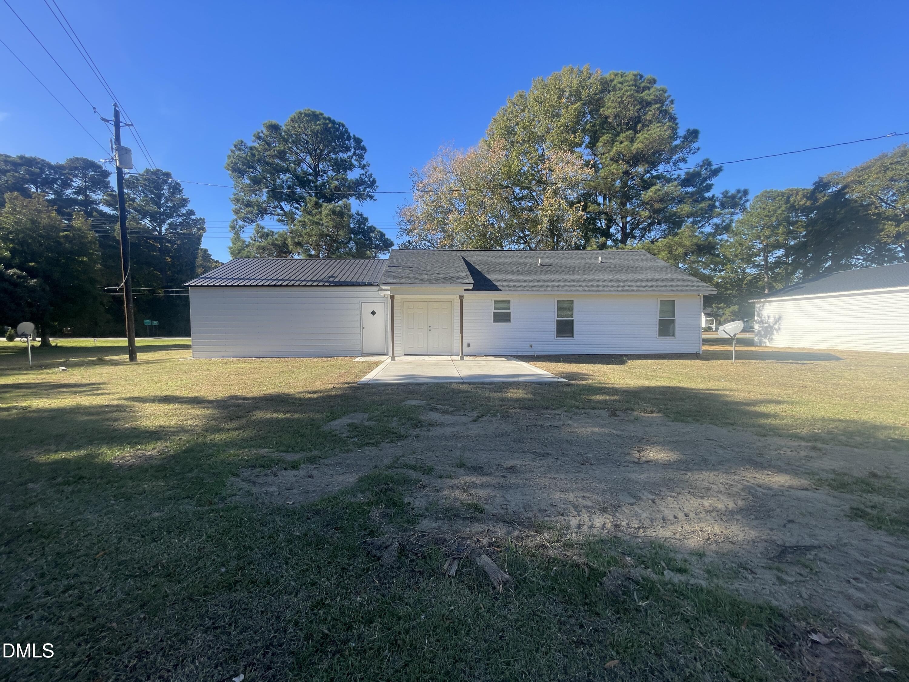 144 Red Hill Church Road Dunn, NC 28334 - Photo 36 of 44 a view of a house with a yard and a large tree