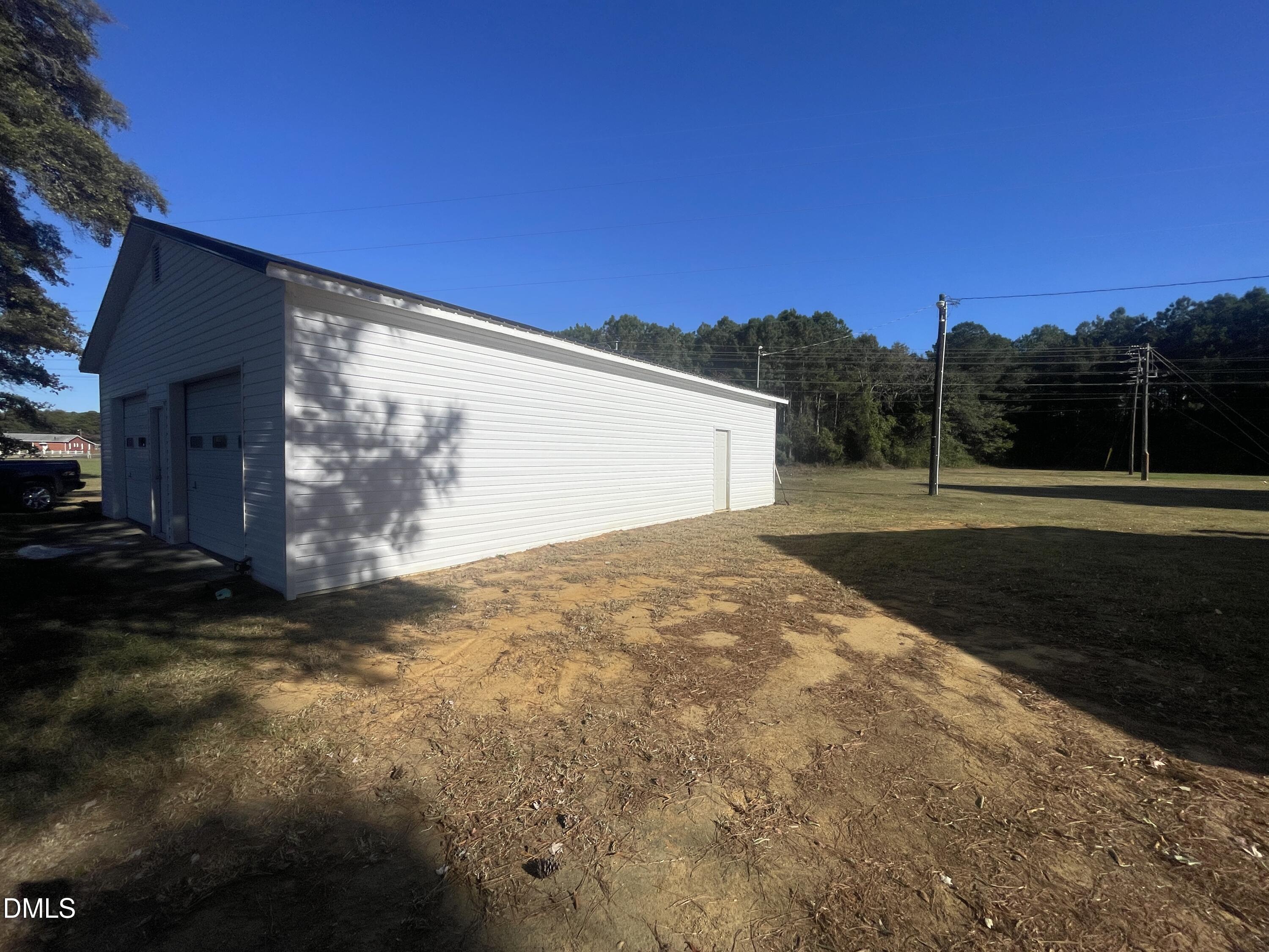 144 Red Hill Church Road Dunn, NC 28334 - Photo 38 of 44 a backyard of a house with lots of green space