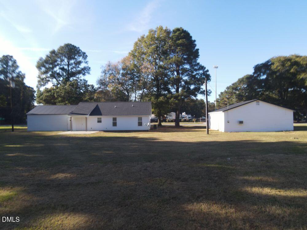 144 Red Hill Church Road Dunn, NC 28334 - Photo 4 of 44 a view of the house with a yard