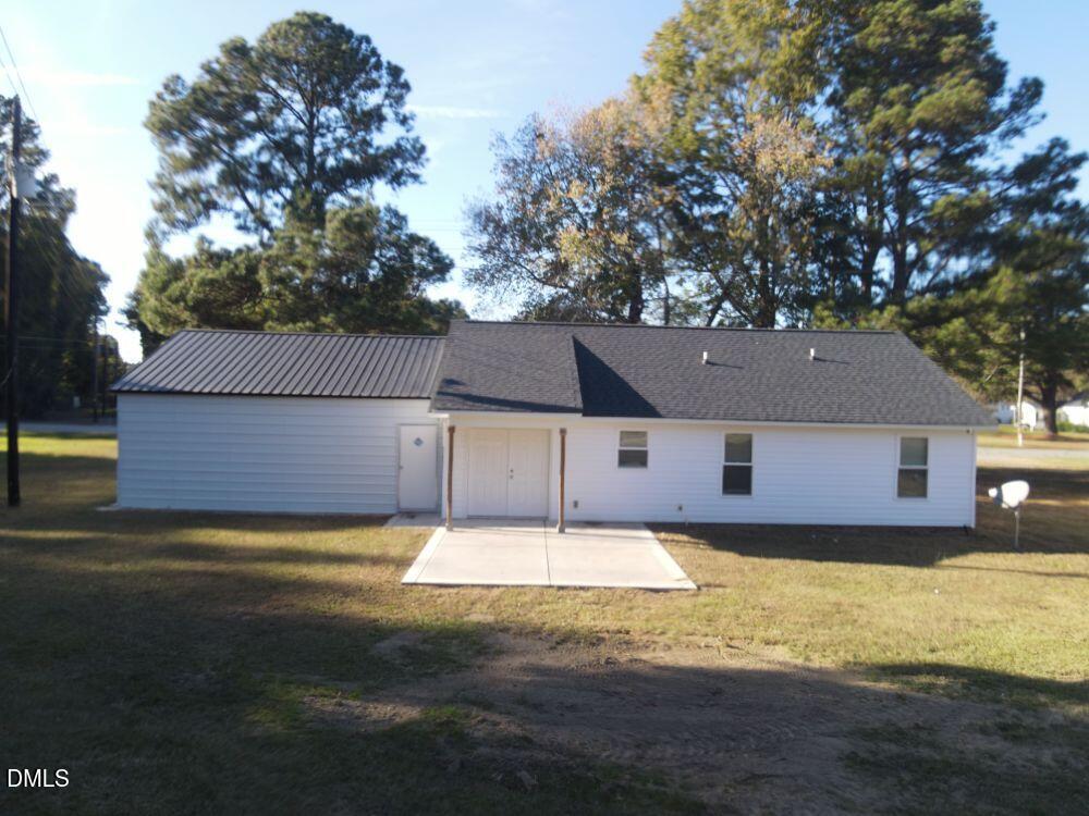 144 Red Hill Church Road Dunn, NC 28334 - Photo 8 of 44 a house that has a tree in front of it