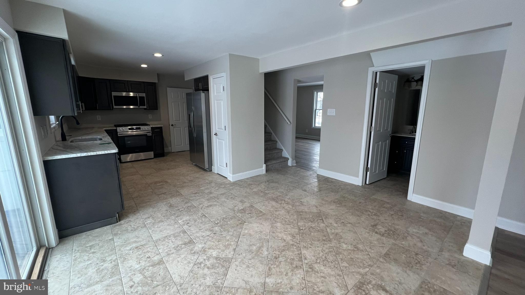 220 Harvard Avenue Stratford, NJ 08084 - Photo 14 of 33 a view of a kitchen with refrigerator and sink