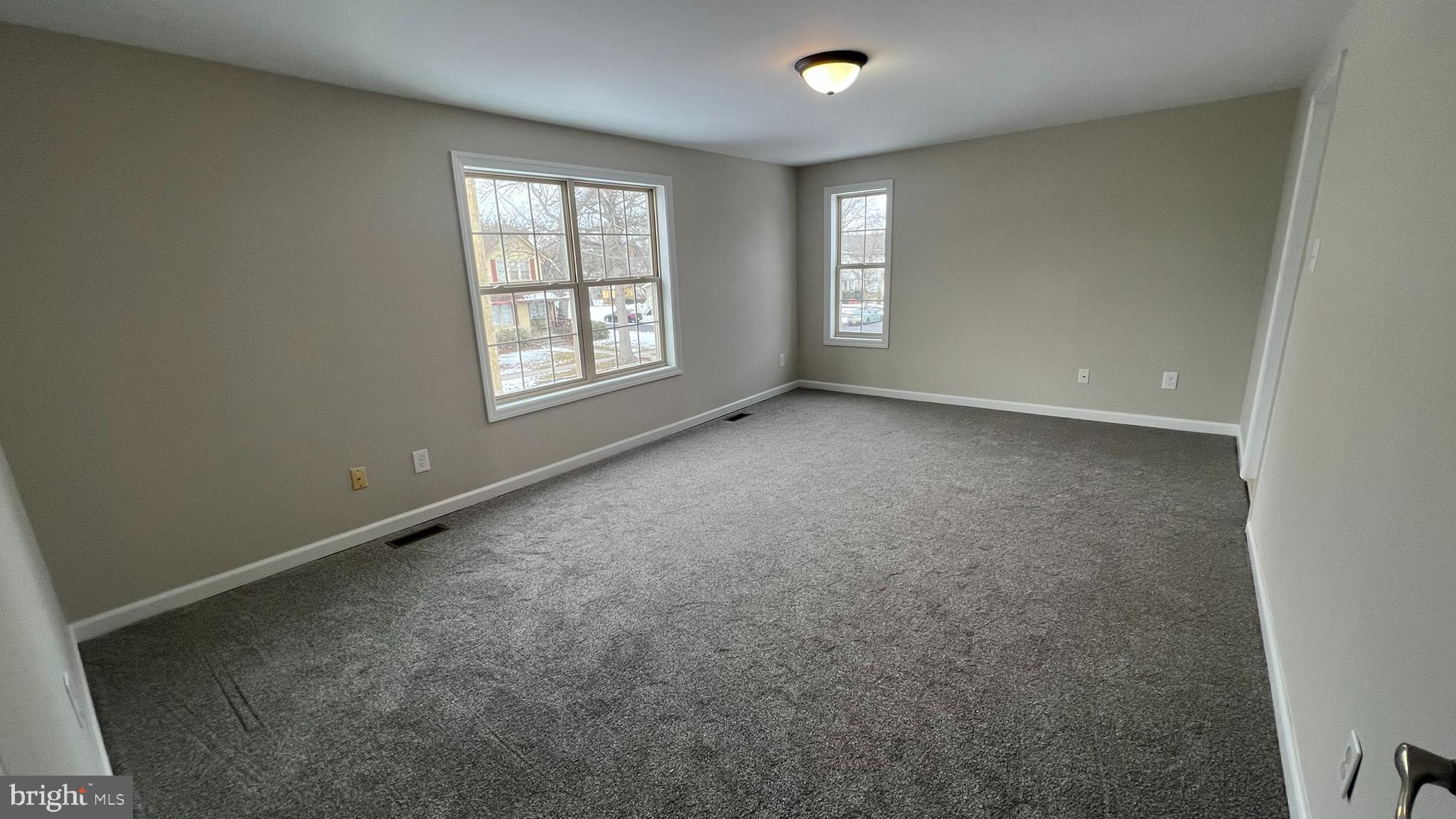 220 Harvard Avenue Stratford, NJ 08084 - Photo 21 of 33 an empty room with windows