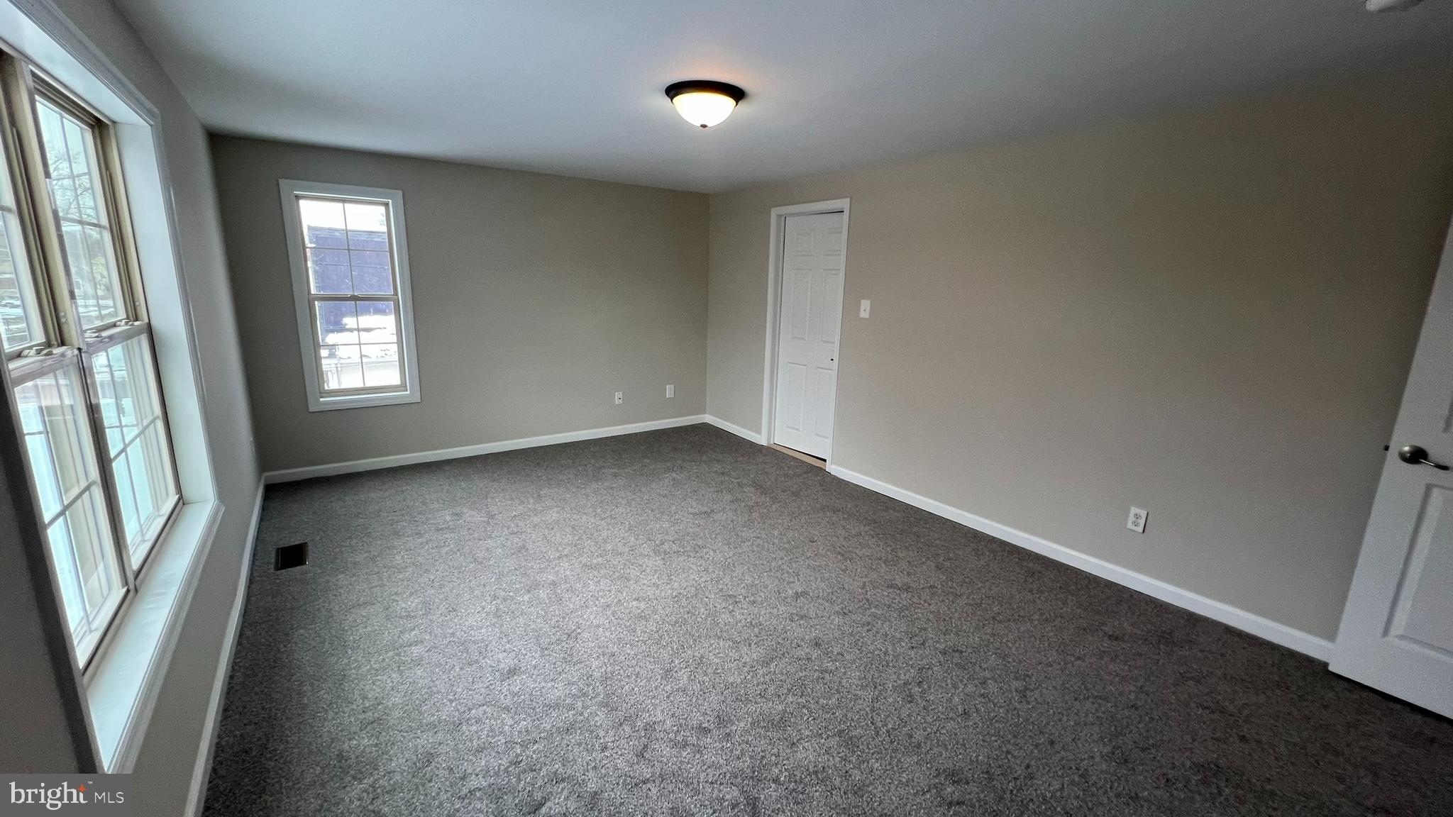 220 Harvard Avenue Stratford, NJ 08084 - Photo 22 of 33 an empty room with windows and entrance