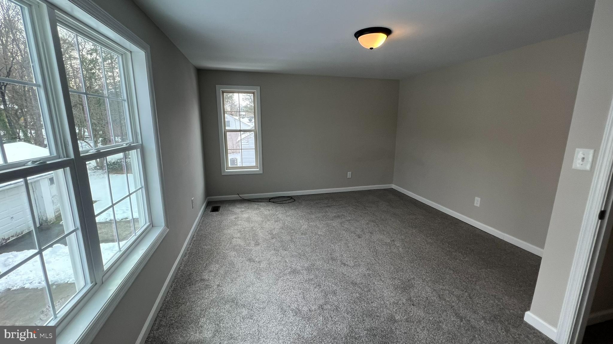 220 Harvard Avenue Stratford, NJ 08084 - Photo 30 of 33 an empty room with windows and entrance