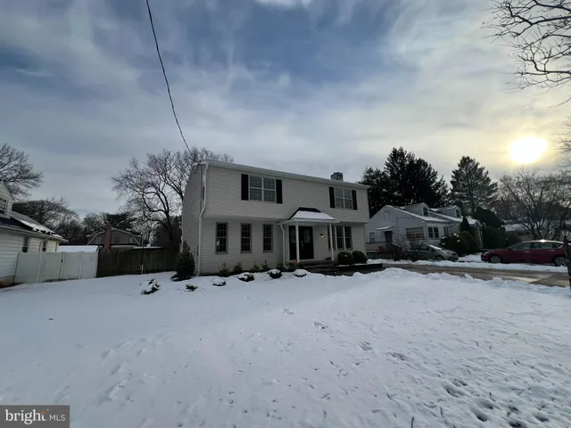 a view of a house with a snow in the yard