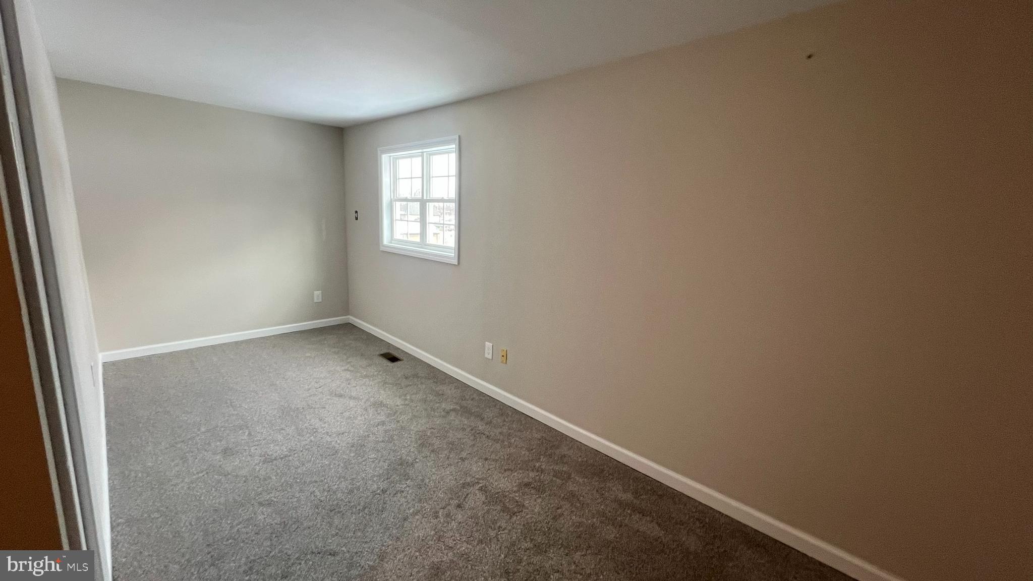 220 Harvard Avenue Stratford, NJ 08084 - Photo 32 of 33 an empty room with a window