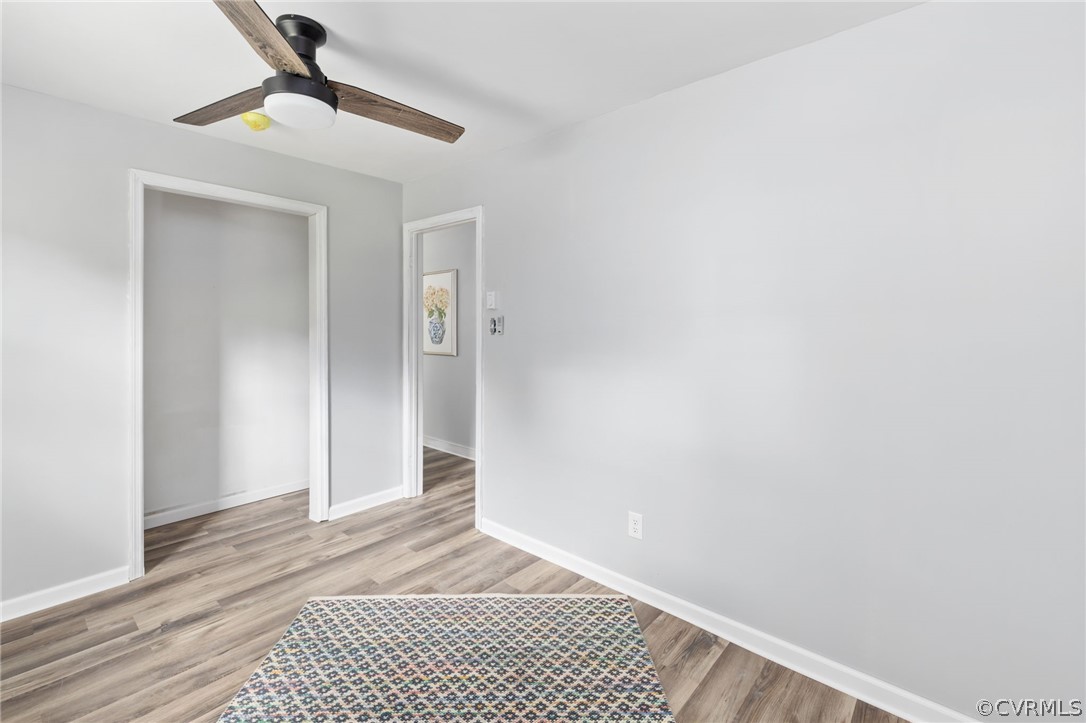 10511 Lunswood Road Chester, VA 23831 - Photo 20 of 27 Bedroom with a closet, ceiling fan, and light wood