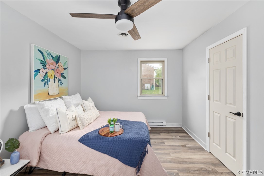 10511 Lunswood Road Chester, VA 23831 - Photo 23 of 27 Primary bedroom with ceiling fan, light hardwood /