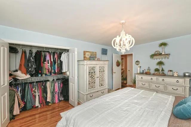a bed room with a bed and a book shelf