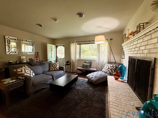 a kitchen with stainless steel appliances granite countertop a refrigerator a stove and a sink