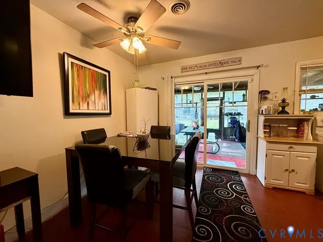a bedroom with furniture and wooden floor