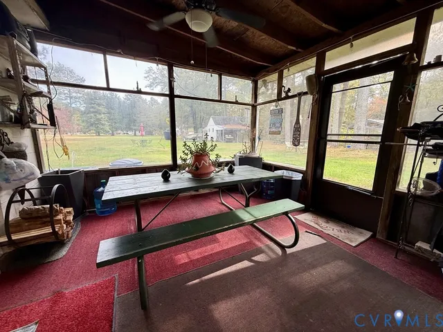 a room with furniture and a large window