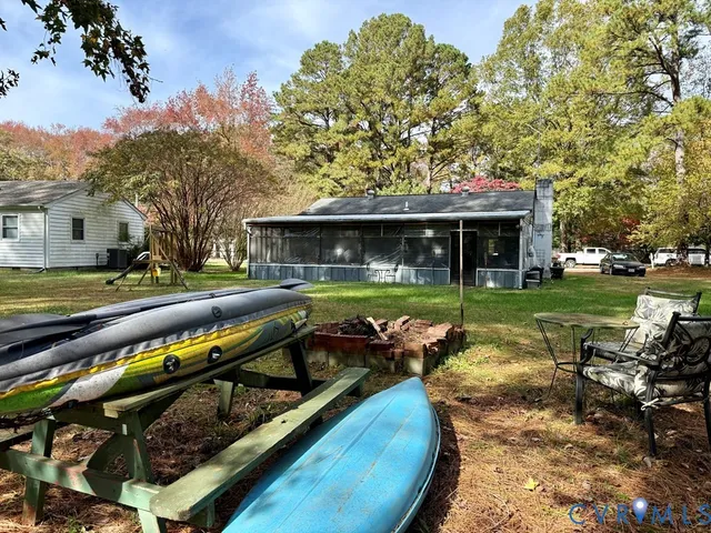 a view of outdoor space with deck and garden