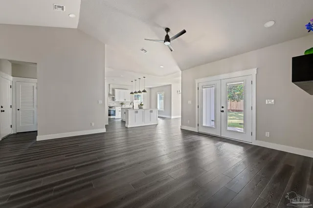 a kitchen with white cabinets and white appliances