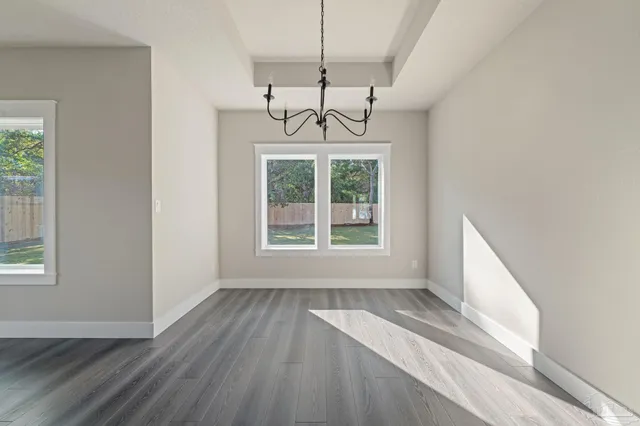 a room with lot of cabinets and wooden floor