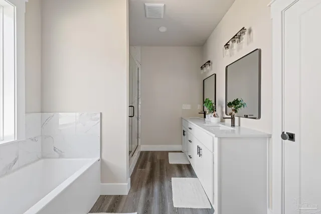 a bathroom with a bathtub and a shower