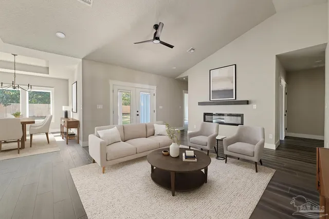 a spacious bedroom with a bed and a couch