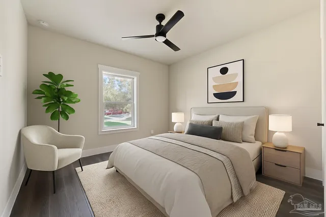 an empty room with wooden floor and window