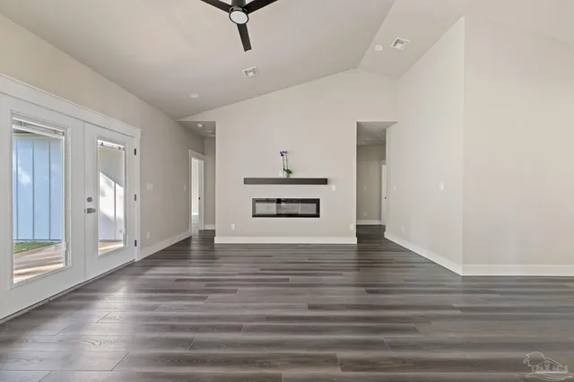 a view of a livingroom with wooden floor