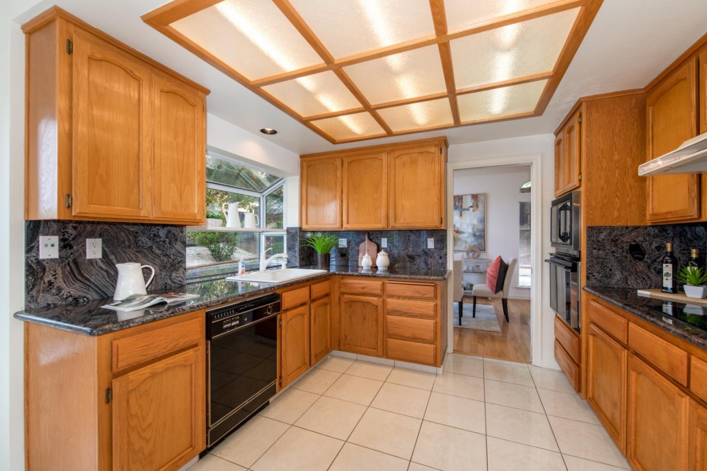 2353 Glenview Drive Milpitas, CA 95035 - Photo 6 of 20 a kitchen with stainless steel appliances granite countertop a sink and cabinets