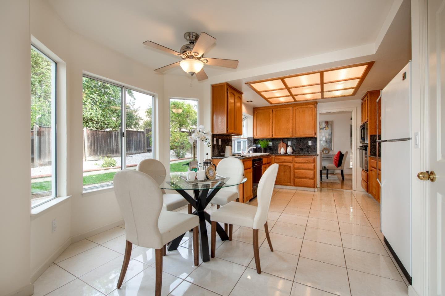 2353 Glenview Drive Milpitas, CA 95035 - Photo 7 of 20 a view of a dining room with furniture wooden floor and chandelier