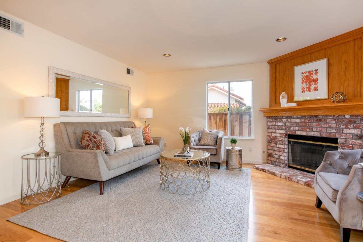 2353 Glenview Drive Milpitas, CA 95035 - Photo 8 of 20 a living room with furniture and a fireplace