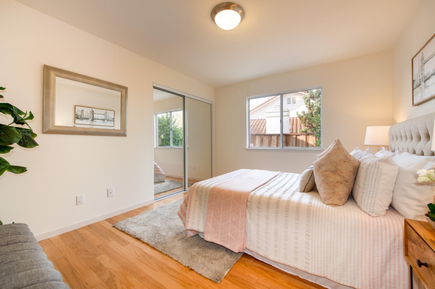2353 Glenview Drive Milpitas, CA 95035 - Photo 9 of 20 a bedroom with a bed and wooden floor