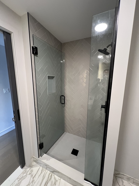 55 Lagrange Street, Unit 1108 Boston, MA 02116 - Photo 15 of 33 a bathroom with a sink and shower