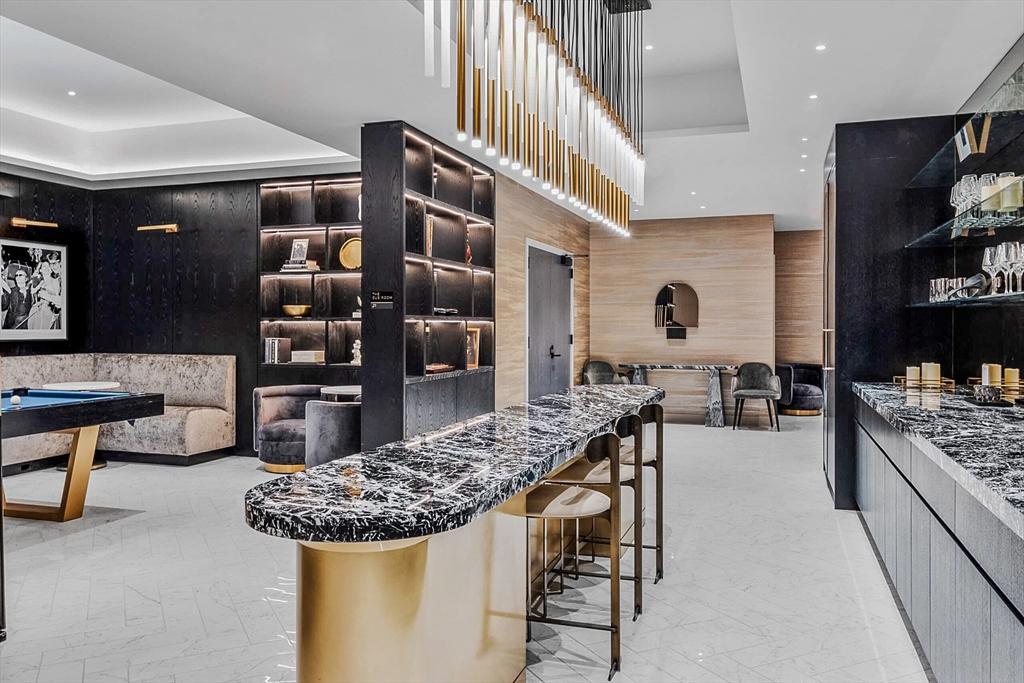 55 Lagrange Street, Unit 1108 Boston, MA 02116 - Photo 28 of 33 a kitchen with stainless steel appliances granite countertop a stove and a refrigerator
