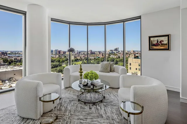 a living room with lots of furniture and a flat screen tv