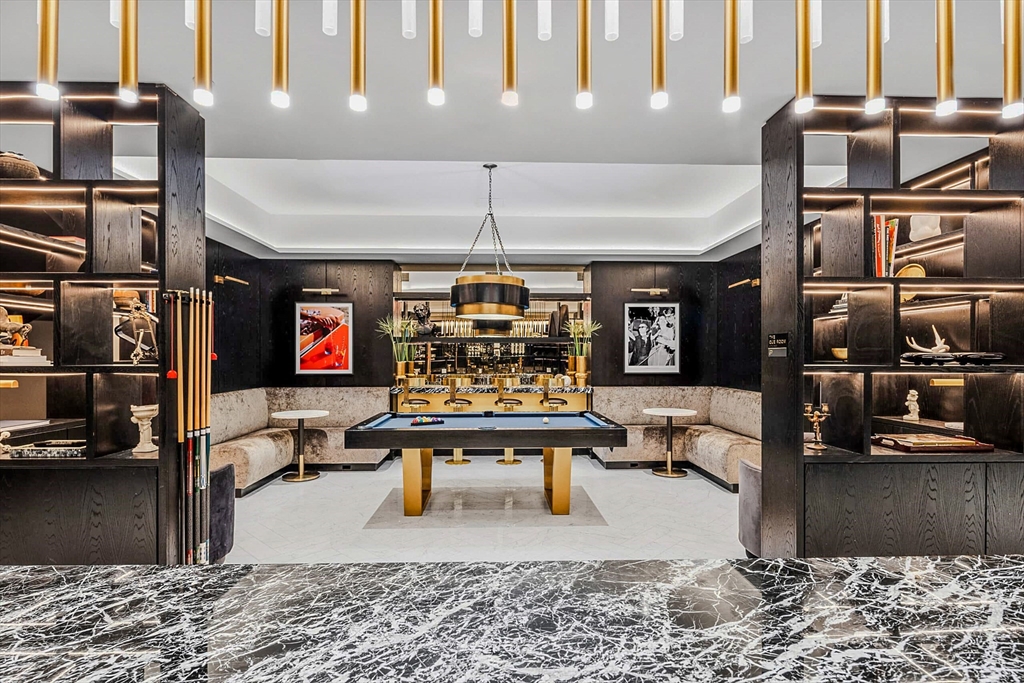 55 Lagrange Street, Unit 1108 Boston, MA 02116 - Photo 31 of 33 a living room with lots of furniture and a flat screen tv