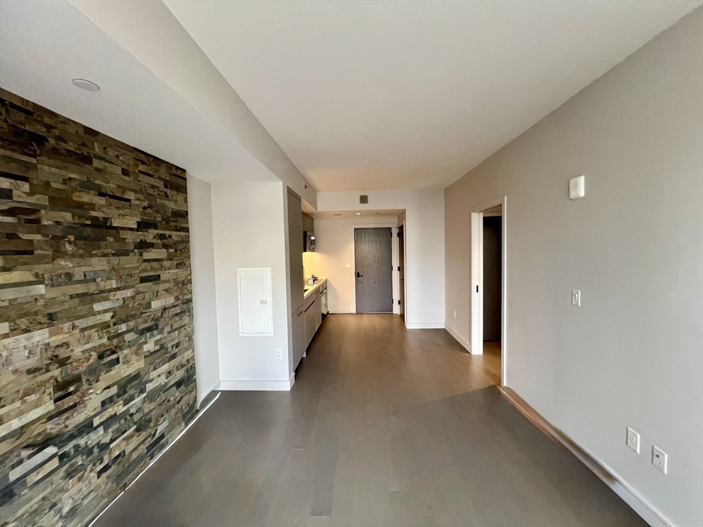55 Lagrange Street, Unit 1108 Boston, MA 02116 - Photo 8 of 33 a view of livingroom with an empty space and a window