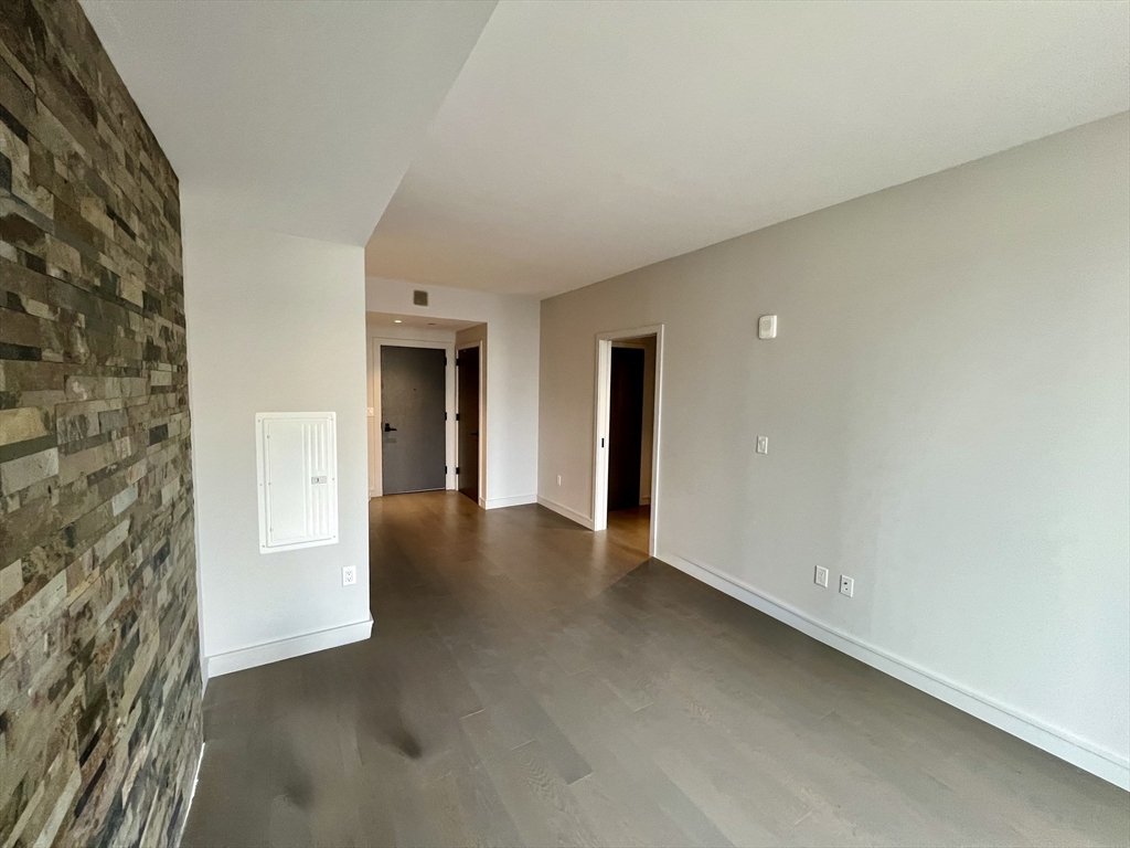 55 Lagrange Street, Unit 1108 Boston, MA 02116 - Photo 9 of 33 a view of an empty room with a fireplace