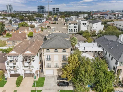 an aerial view of a residential apartment building with a yard