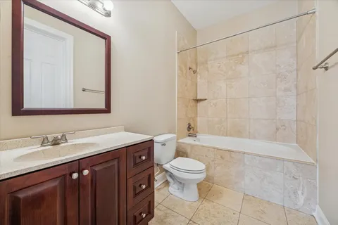 a bathroom with a sink a toilet and a bathtub
