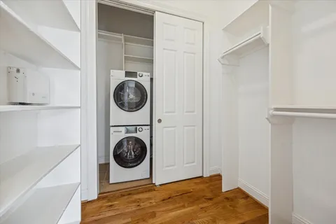 a view of a bedroom with washer and dryer