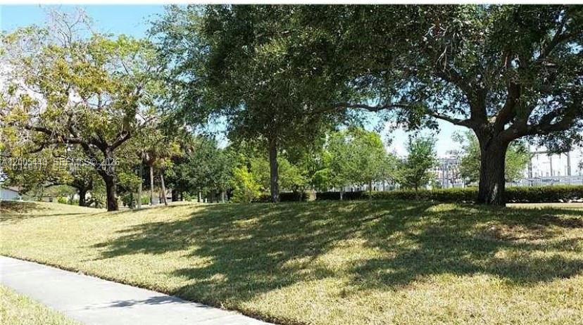 9006 Southwest 137th Street, Unit 18 Miami, FL 33176 - Photo 11 of 13 a backyard of a house with lots of green space