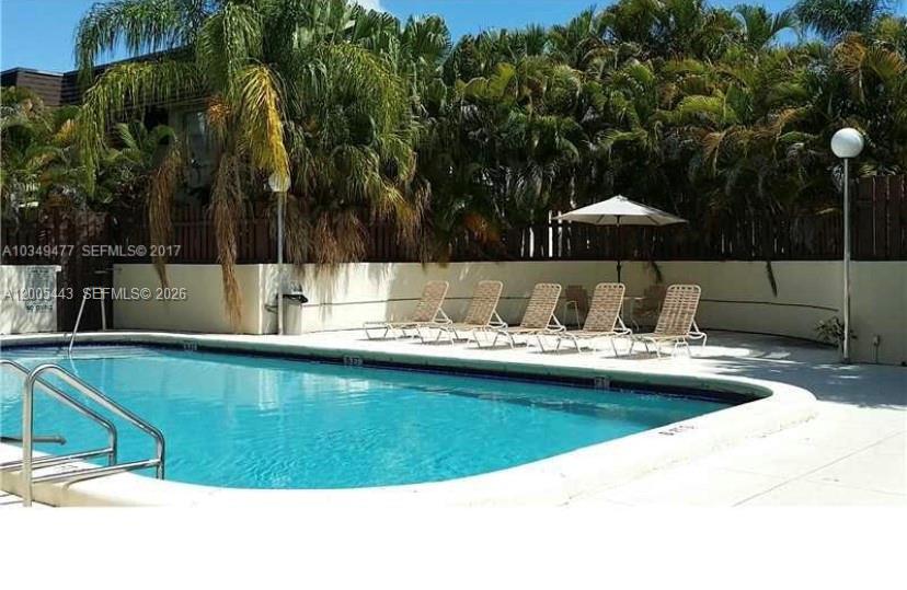 9006 Southwest 137th Street, Unit 18 Miami, FL 33176 - Photo 13 of 13 a view of swimming pool with a patio