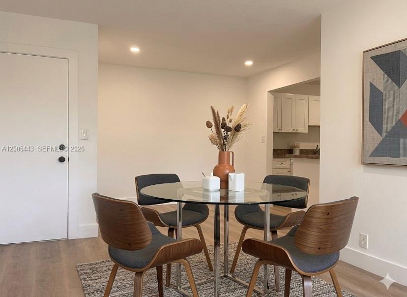 9006 Southwest 137th Street, Unit 18 Miami, FL 33176 - Photo 3 of 13 a view of a dining room with furniture and wooden floor