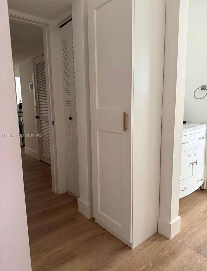 9006 Southwest 137th Street, Unit 18 Miami, FL 33176 - Photo 7 of 13 a view of a hallway with wooden floor