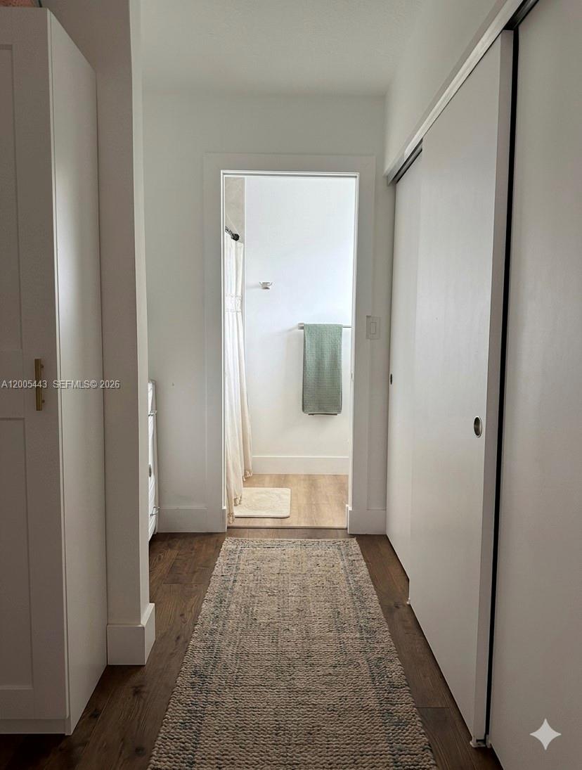 9006 Southwest 137th Street, Unit 18 Miami, FL 33176 - Photo 8 of 13 a view of a hallway with a glass door and furniture