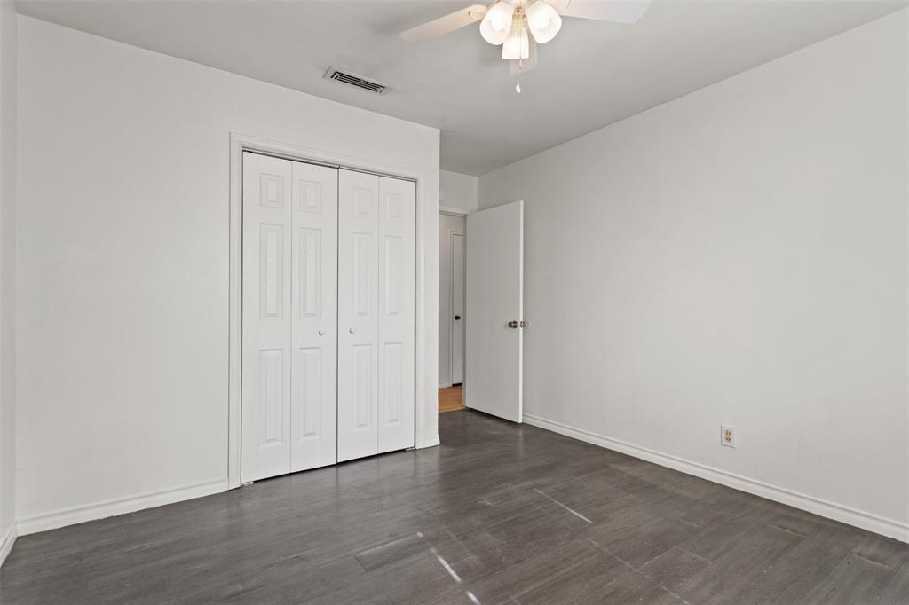 3126 Colgate Avenue Tyler, TX 75701 - Photo 19 of 33 an empty room with a chandelier fan