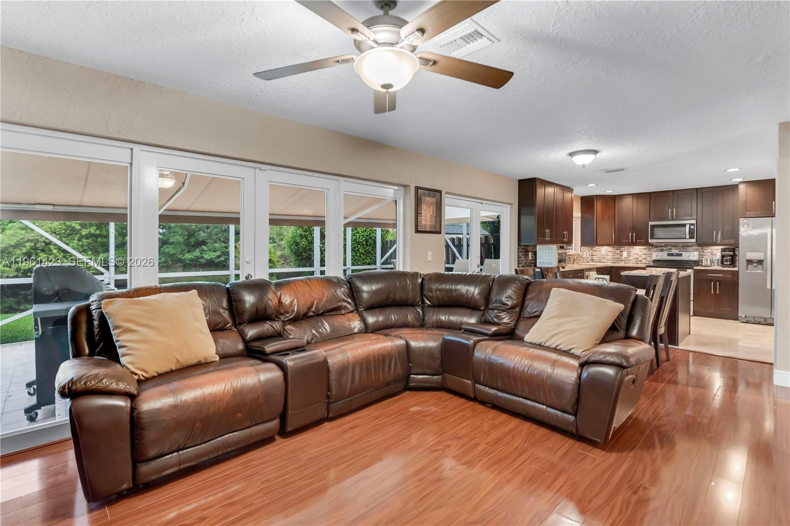 21451 Sawmill Court Boca Raton, FL 33498 - Photo 11 of 67 a living room with furniture and a large window