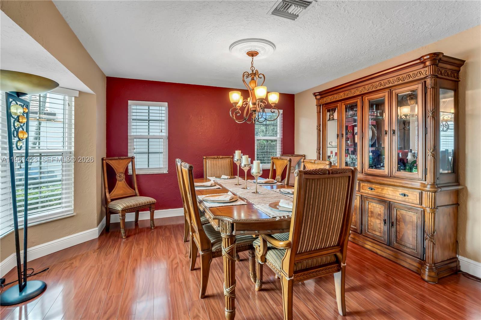 21451 Sawmill Court Boca Raton, FL 33498 - Photo 2 of 67 a dining room with furniture window and wooden floor