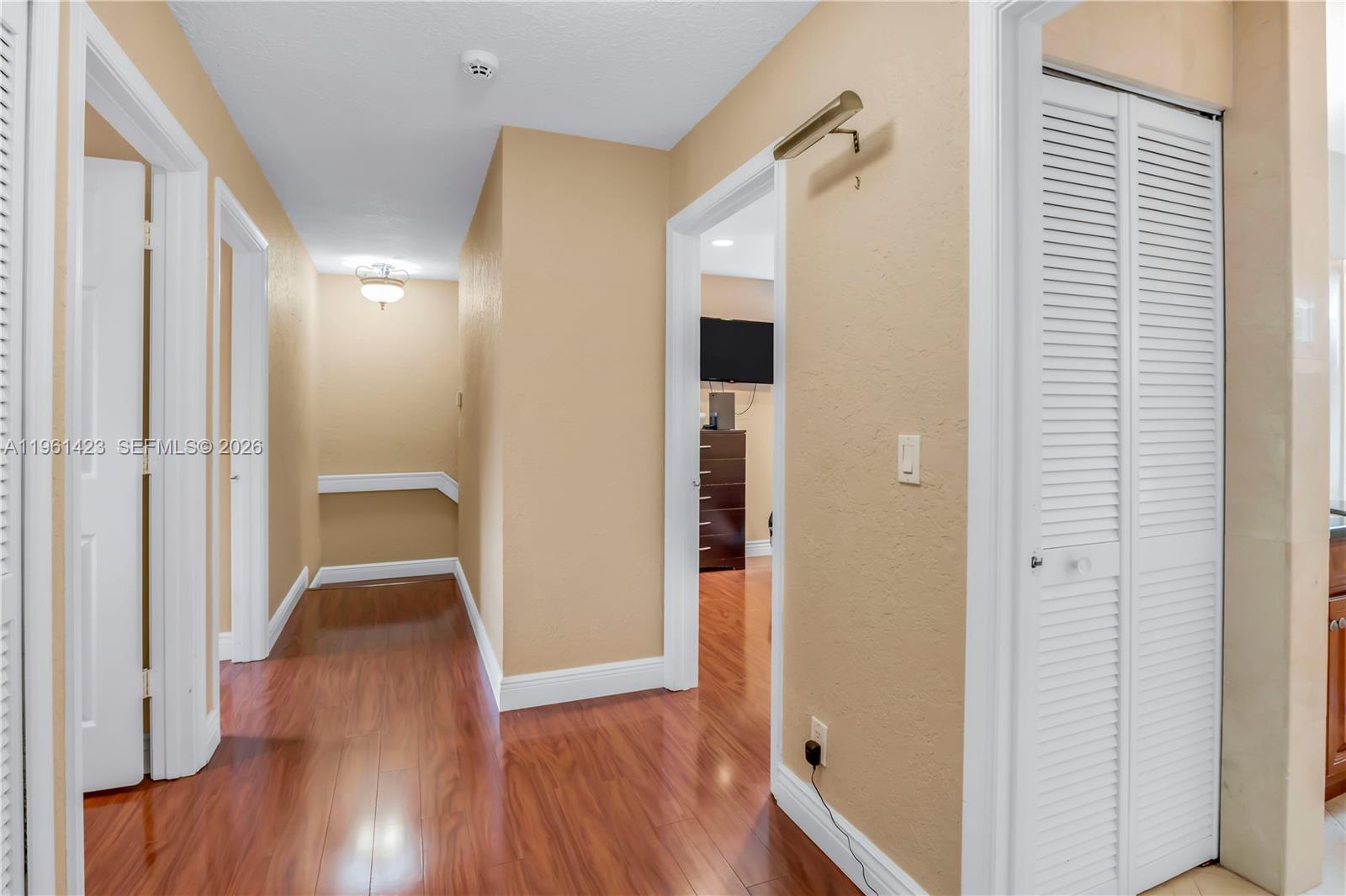 21451 Sawmill Court Boca Raton, FL 33498 - Photo 25 of 67 a view of a hallway with wooden floor