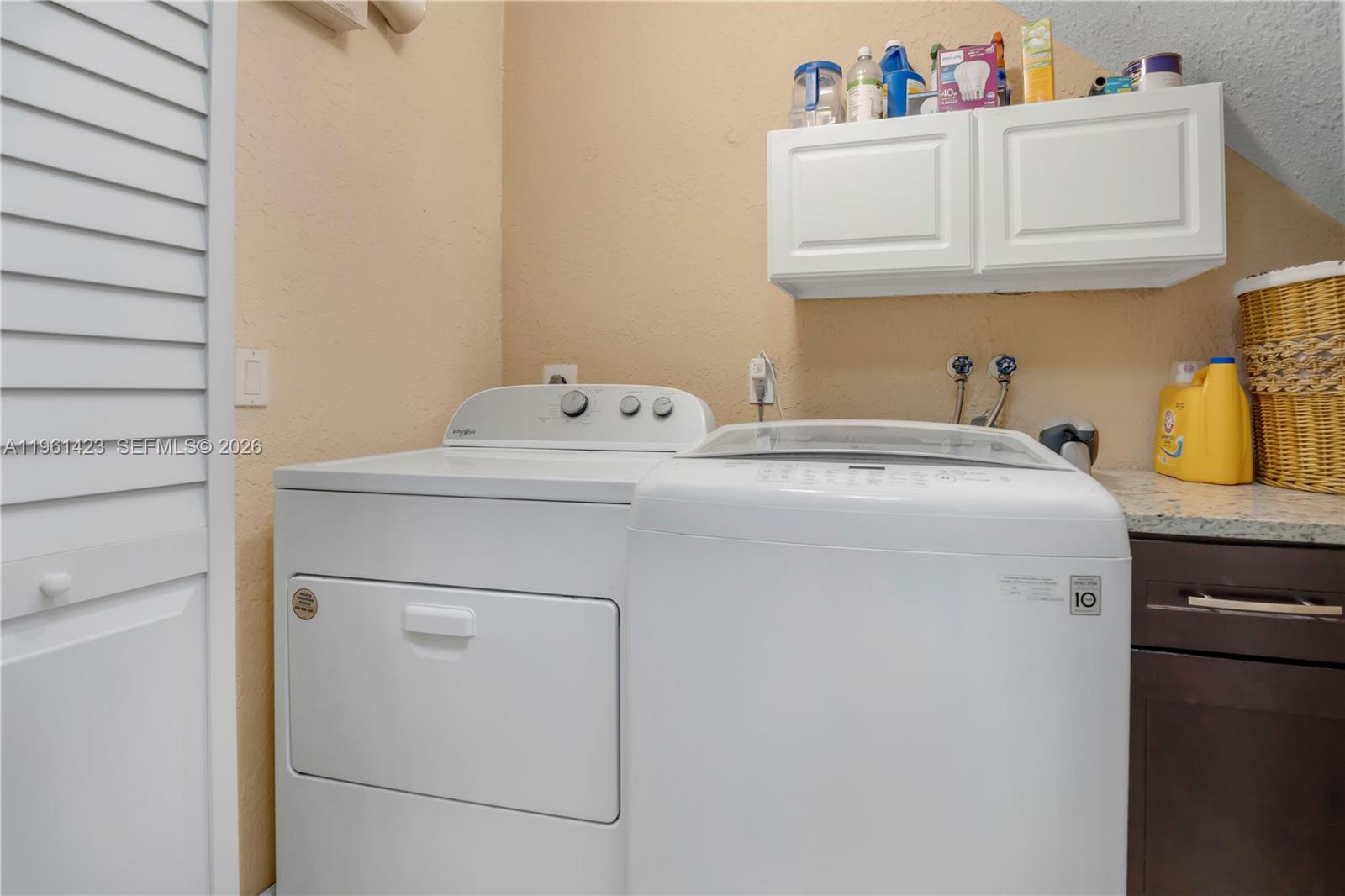 21451 Sawmill Court Boca Raton, FL 33498 - Photo 28 of 67 a utility room with dryer and washer
