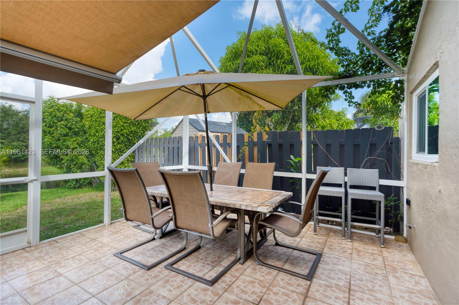21451 Sawmill Court Boca Raton, FL 33498 - Photo 29 of 67 a view of backyard with barbeque grill and outdoor seating