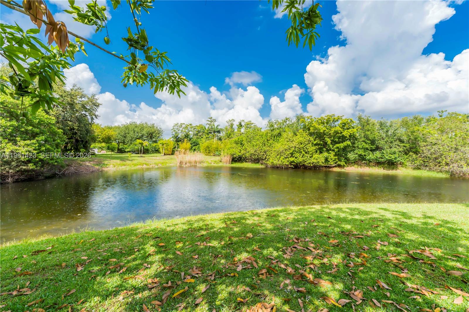 21451 Sawmill Court Boca Raton, FL 33498 - Photo 32 of 67 a view of a lake with a big yard