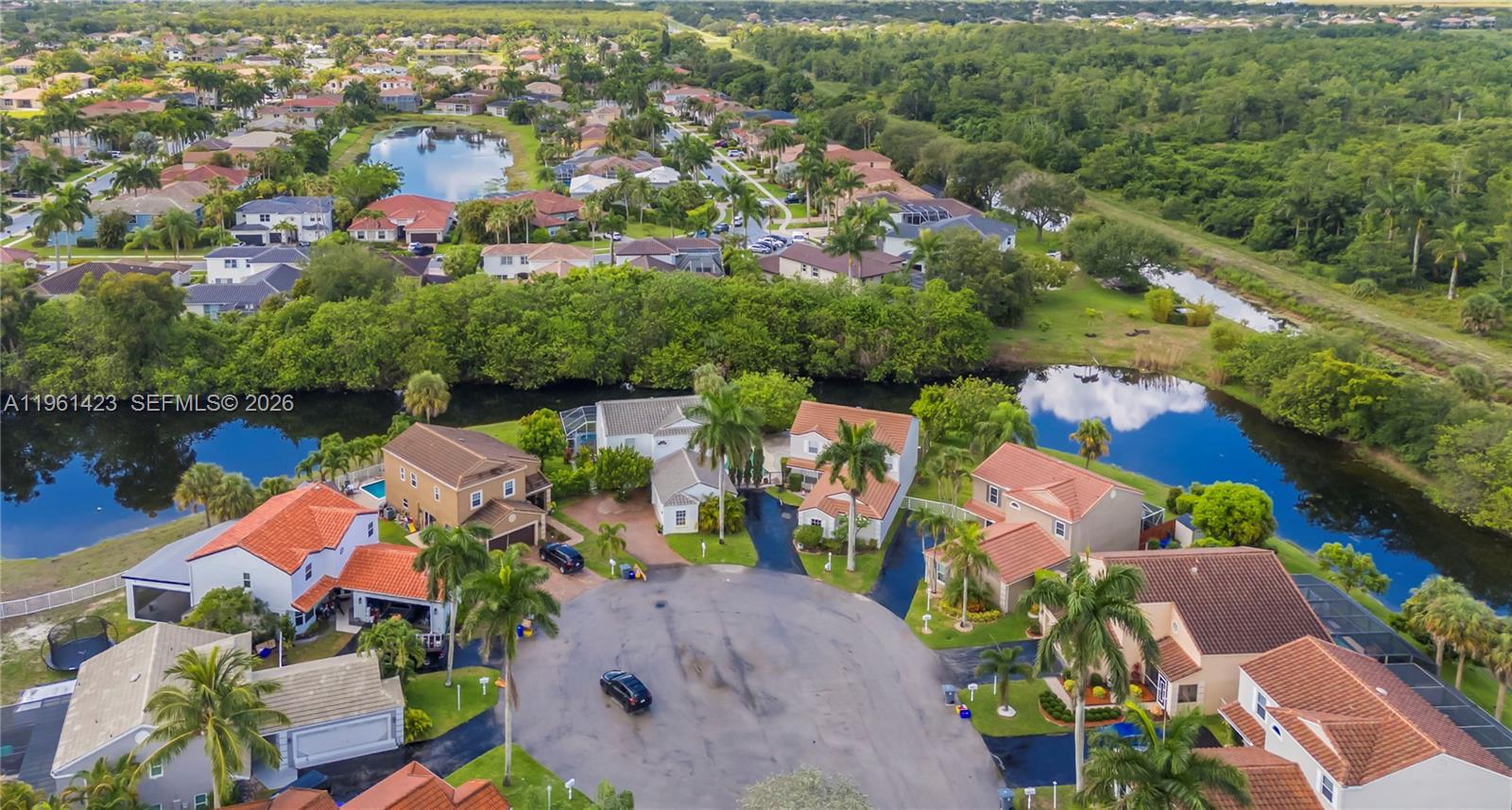 21451 Sawmill Court Boca Raton, FL 33498 - Photo 44 of 67 an aerial view of a houses with a lake view